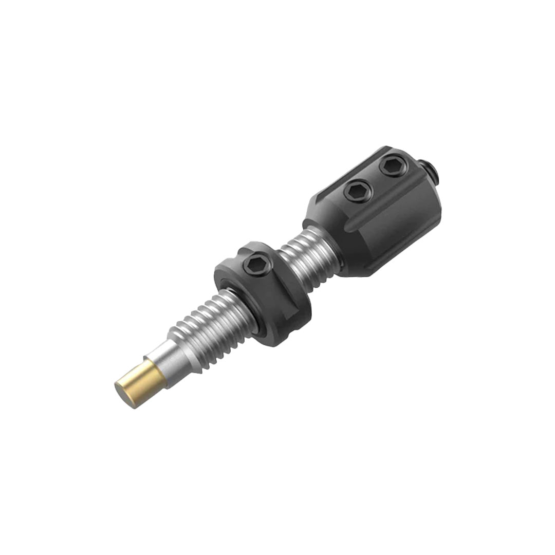 Photo of black Bicaster plunger button on a white background.