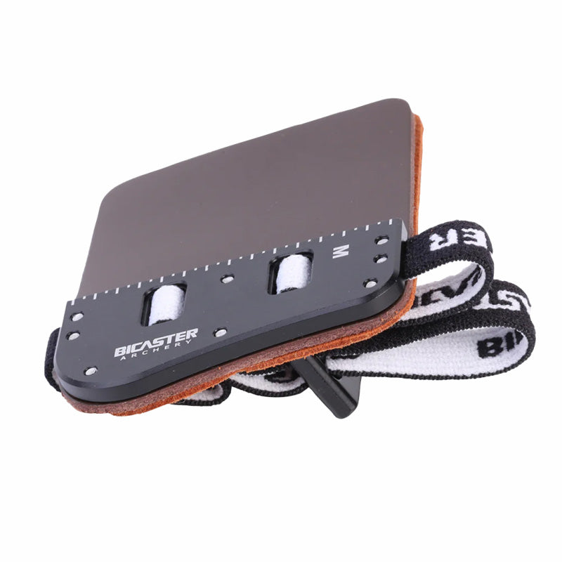 Photo of layers of the Bicaster Barebow Tab. The elastic finger olders can be seen at the back.