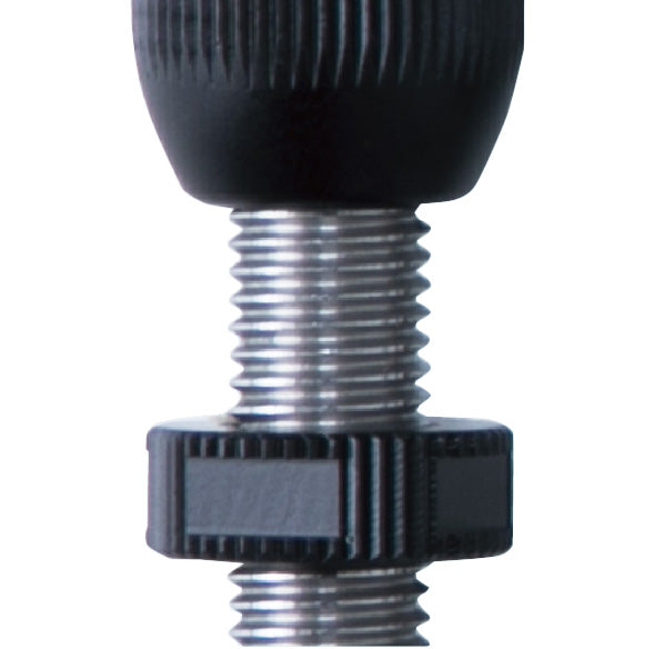 Closeup photo of Shibuya DX gold tip plunger button.