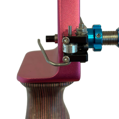 Sight window view of a Spigarelli ZT arrow rest installed on a pink bow.