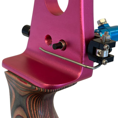 Wire side view of a Spigarelli ZT arrow rest installed on a pink bow.